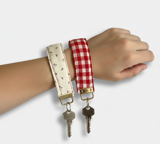 Two wristlets  Red gingham with keys attached on a plain background
